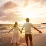 Couple walking on beach during Valentines vacation
